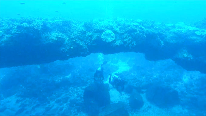 Underwater stone arch draws visitors to island district